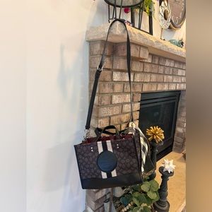 Like new Coach purse, wrist and shoulder straps.